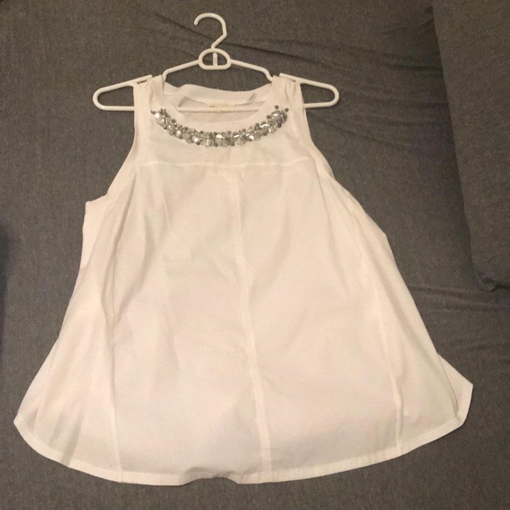 Sleeveless white top with floral sequin detail